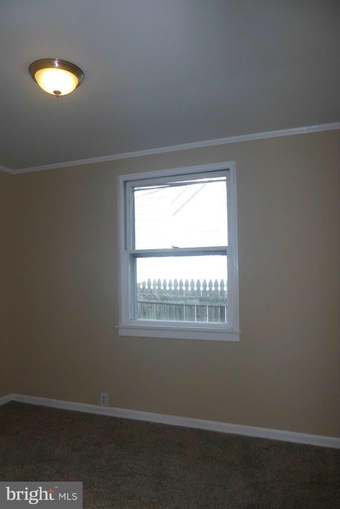 8247 Bullneck Road Baltimore, MD 21222 - Photo 9 of 16 a view of a room that has a window