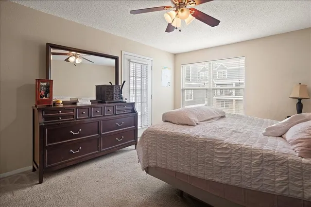 a view of a balcony with chairs and the entryway