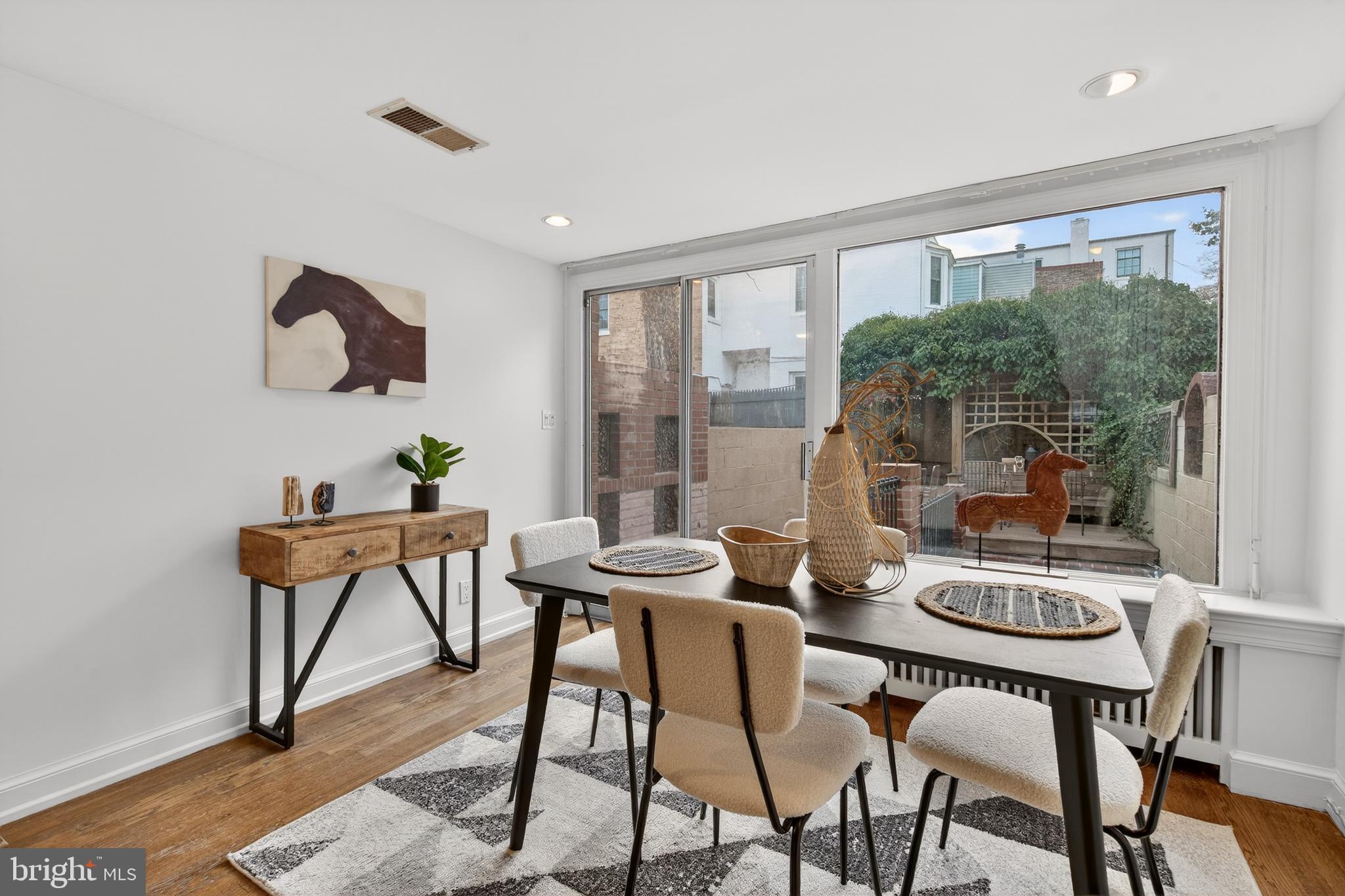 1610 33rd Street Northwest Washington, DC 20007 - Photo 7 of 25 Wall of windows & sliding door to garden