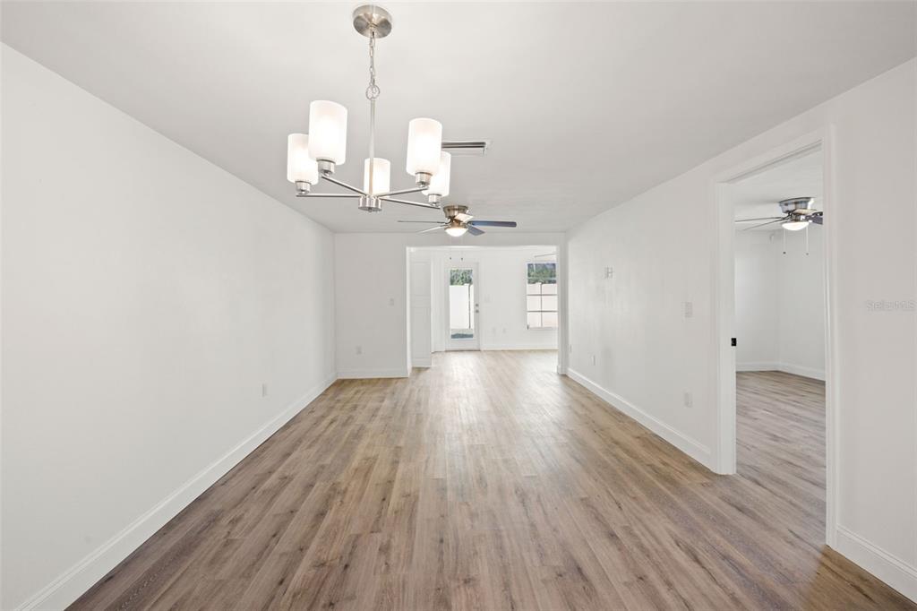 4127 Stratford Drive, Unit 4127 New Port Richey, FL 34652 - Photo 15 of 45 a view of a kitchen with a sink and wooden floor