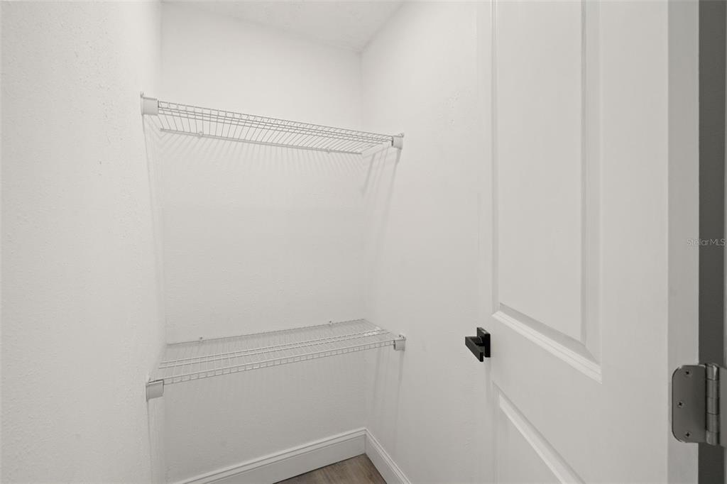 4127 Stratford Drive, Unit 4127 New Port Richey, FL 34652 - Photo 20 of 45 a view of a room with racks on the wall