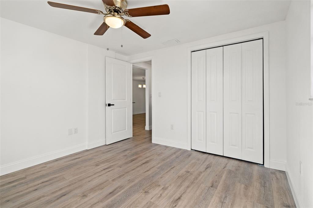 4127 Stratford Drive, Unit 4127 New Port Richey, FL 34652 - Photo 25 of 45 a view of an empty room and wooden floor