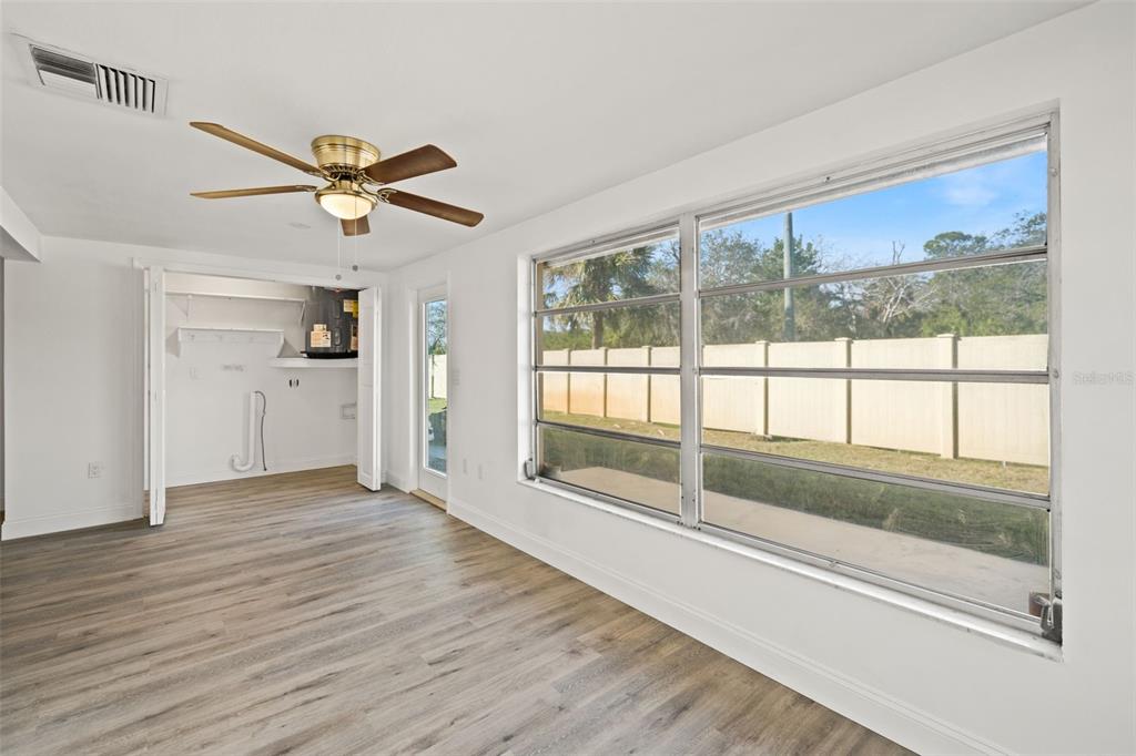 4127 Stratford Drive, Unit 4127 New Port Richey, FL 34652 - Photo 28 of 45 a view of empty room with wooden floor and fan