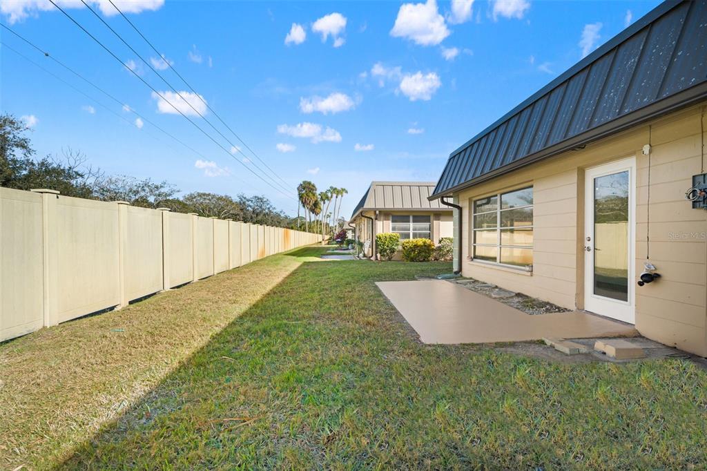 4127 Stratford Drive, Unit 4127 New Port Richey, FL 34652 - Photo 31 of 45 a view of a house with backyard and sitting area