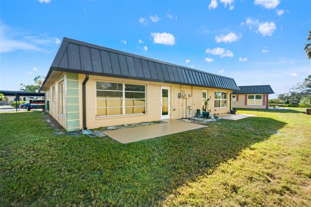4127 Stratford Drive, Unit 4127 New Port Richey, FL 34652 - Photo 33 of 45 a view of an house with backyard and pool