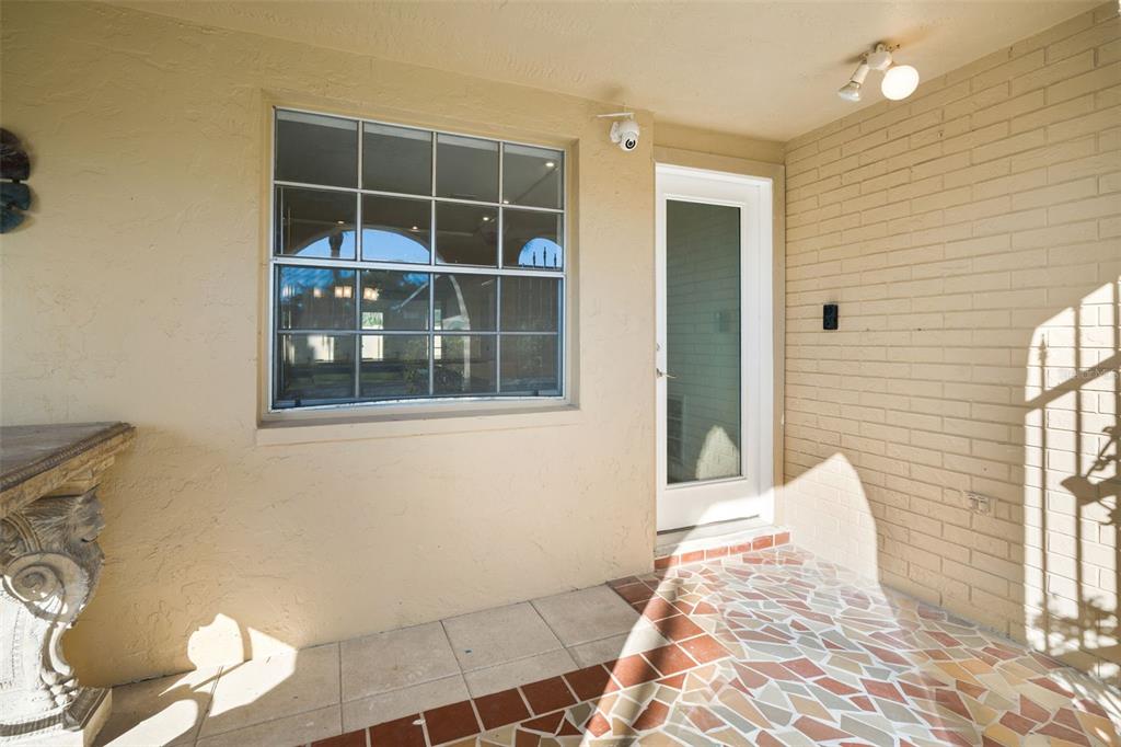 4127 Stratford Drive, Unit 4127 New Port Richey, FL 34652 - Photo 4 of 45 a view of a bedroom with wooden floor and a window