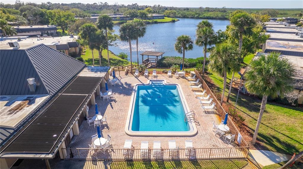 4127 Stratford Drive, Unit 4127 New Port Richey, FL 34652 - Photo 41 of 45 an aerial view of residential houses with outdoor space and river