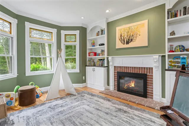 a living room with furniture and a fireplace