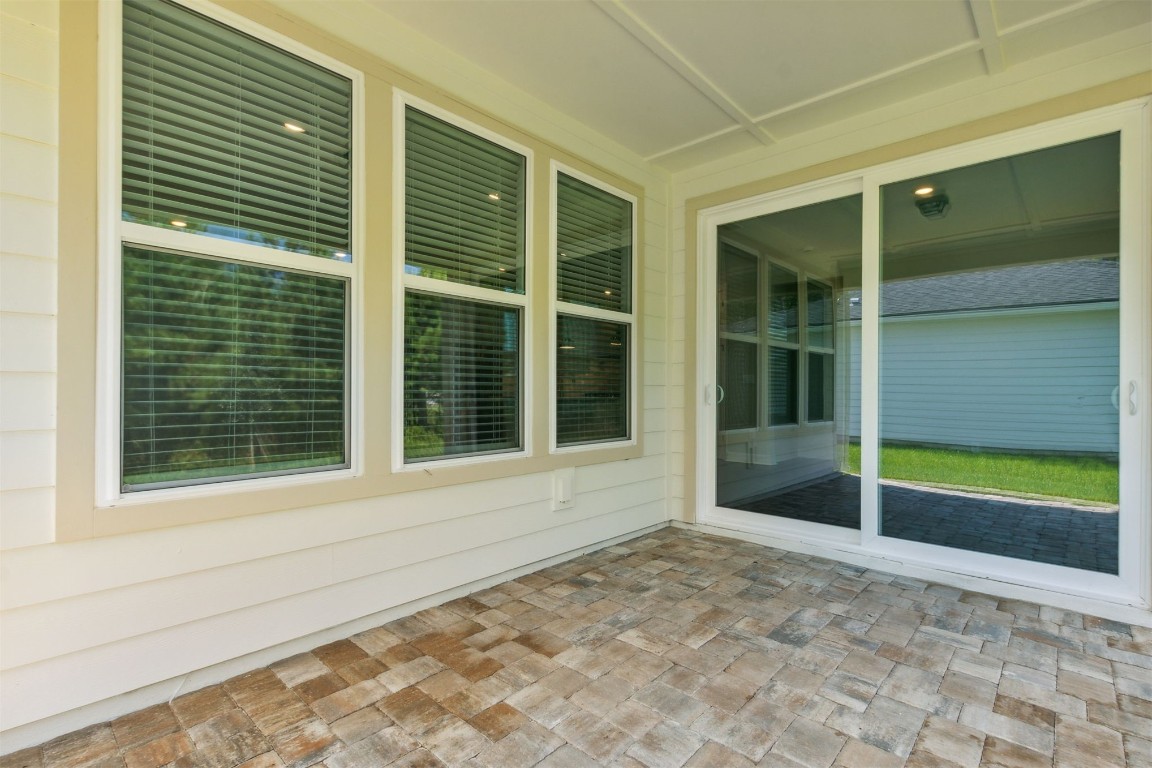 840 Continuum Loop Yulee, FL 32097 - Photo 12 of 64 a view of yellow door and a window