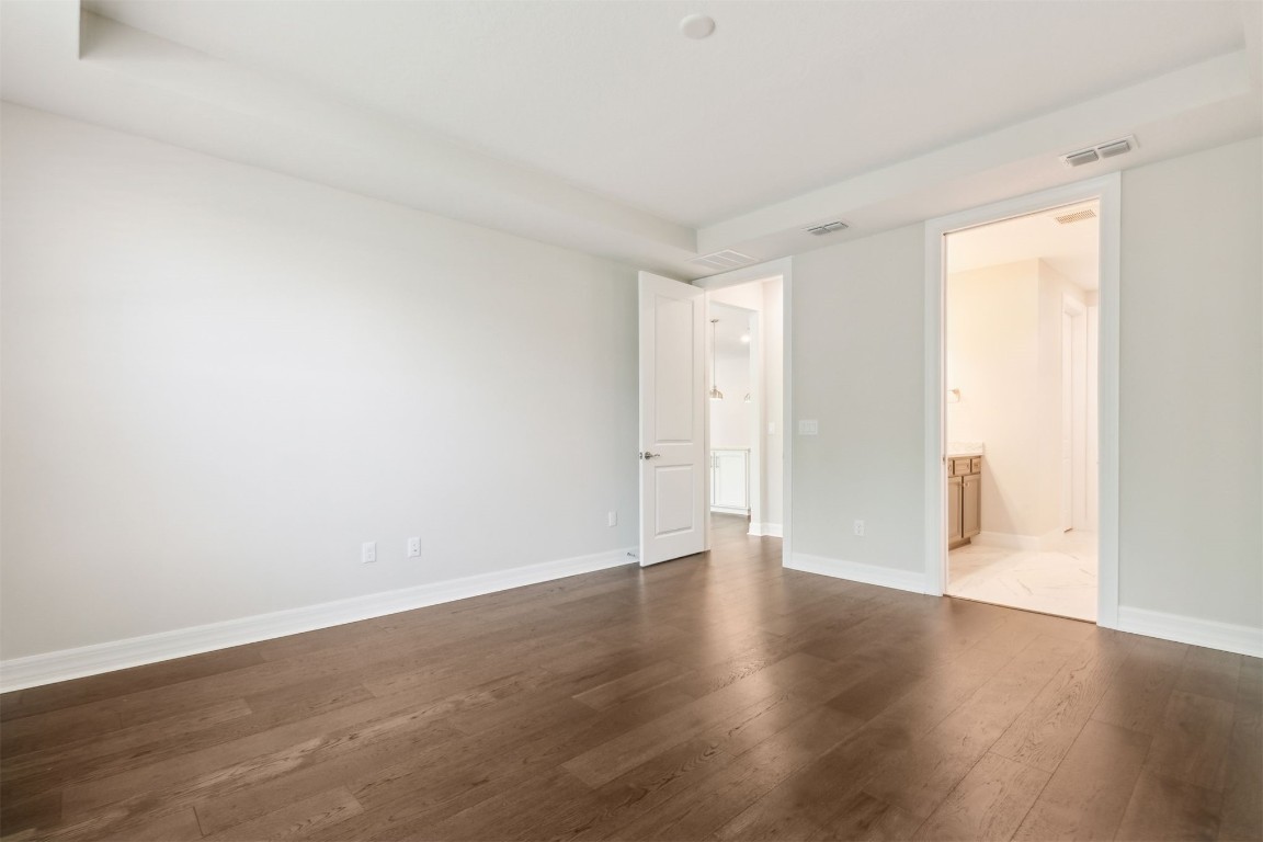 840 Continuum Loop Yulee, FL 32097 - Photo 32 of 64 a view of an empty room with wooden floor and a window
