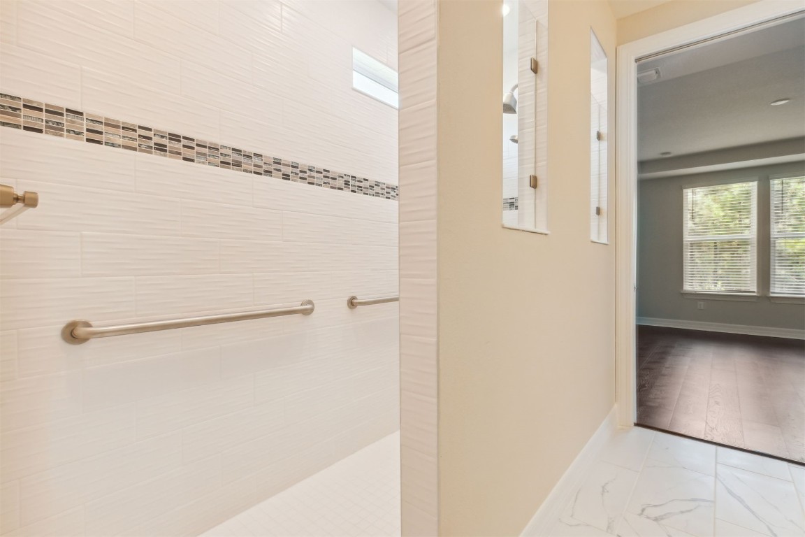 840 Continuum Loop Yulee, FL 32097 - Photo 33 of 64 a bathroom with a glass shower door