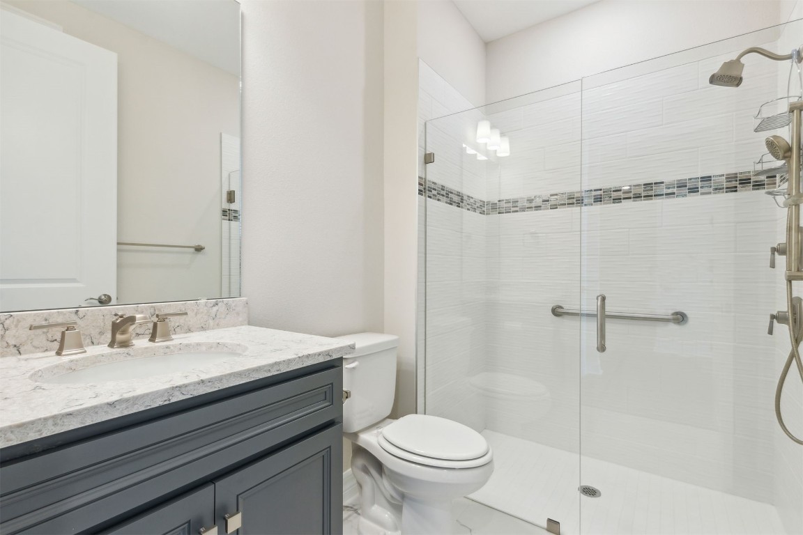 840 Continuum Loop Yulee, FL 32097 - Photo 7 of 64 a bathroom with a sink toilet vanity and shower