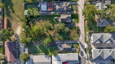 an aerial view of a house with lake view