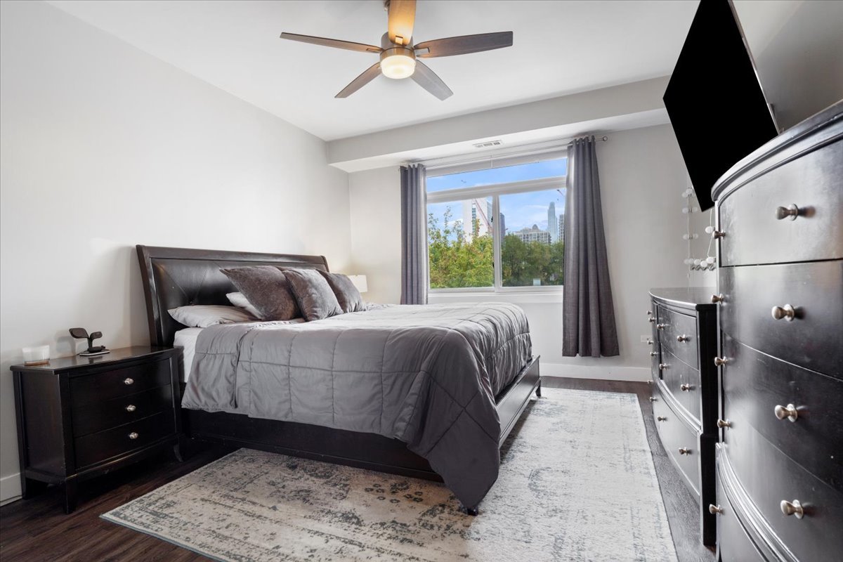 680 North Green Street, Unit 412 Chicago, IL 60642 - Photo 11 of 20 a bedroom with a large bed and a window