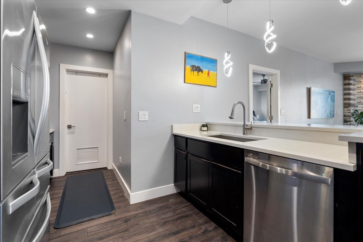 680 North Green Street, Unit 412 Chicago, IL 60642 - Photo 5 of 20 a bathroom with a sink a toilet a mirror and vanity