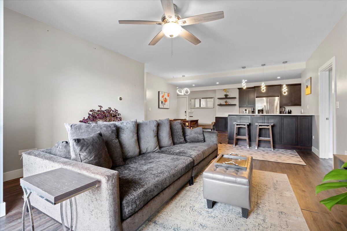680 North Green Street, Unit 412 Chicago, IL 60642 - Photo 8 of 20 a living room with furniture and kitchen view