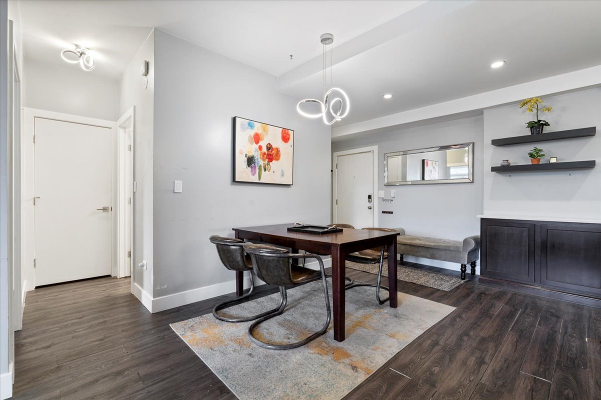 680 North Green Street, Unit 412 Chicago, IL 60642 - Photo 9 of 20 a view of a livingroom with furniture and a workspace