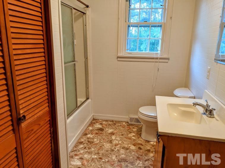 362 Tinker Road Chase City, VA 23924 - Photo 13 of 21 a bathroom with a sink toilet and shower