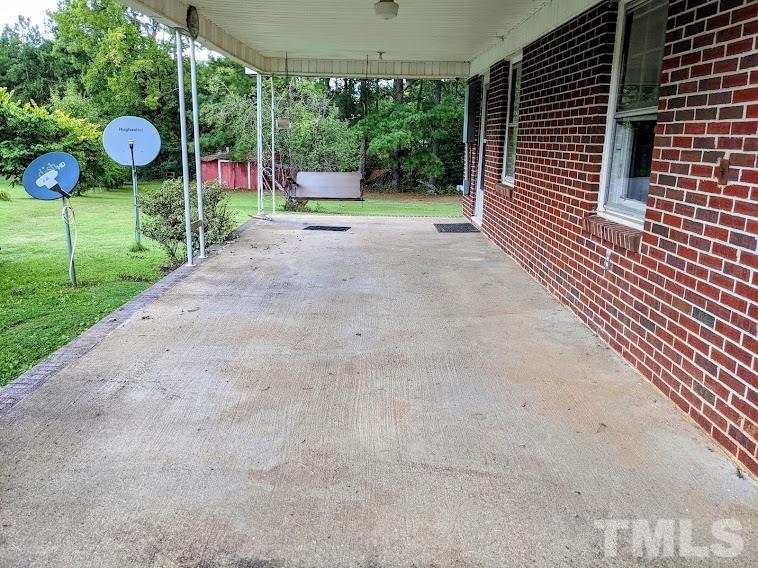 362 Tinker Road Chase City, VA 23924 - Photo 14 of 21 a view of a backyard with sitting area and porch