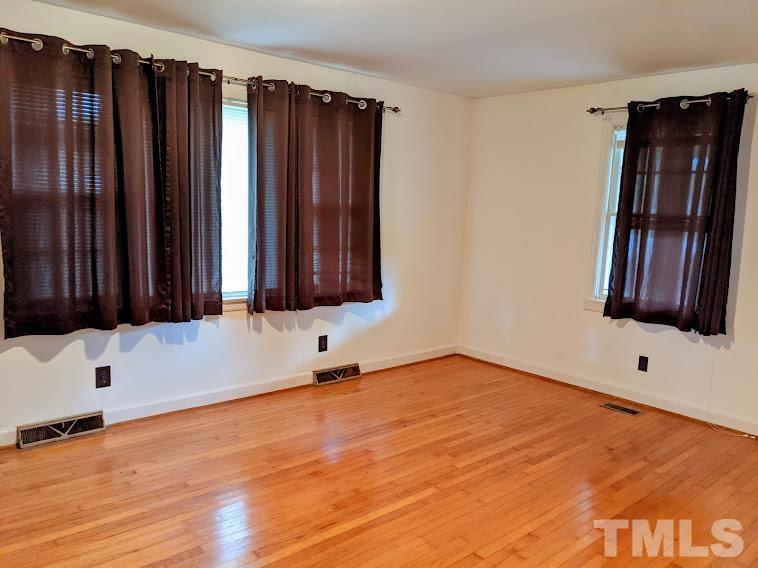 362 Tinker Road Chase City, VA 23924 - Photo 4 of 21 a view of an empty room with wooden floor and a window