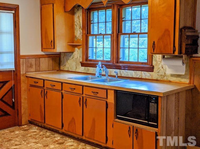 362 Tinker Road Chase City, VA 23924 - Photo 6 of 21 a kitchen with stainless steel appliances granite countertop a sink stove and cabinets