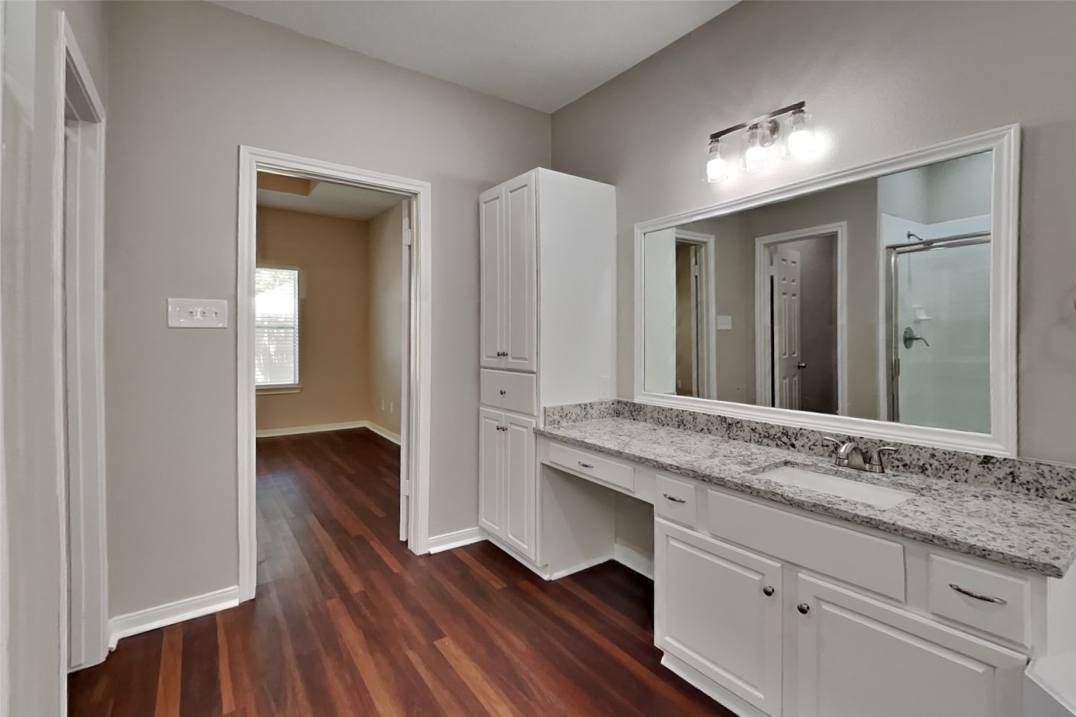 8615 Mile Run Road Humble, TX 77346 - Photo 8 of 19 a bathroom with a sink and a mirror