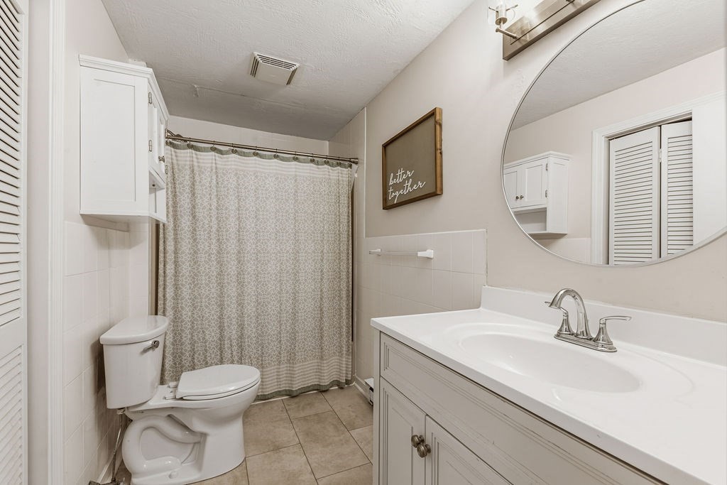 10 Erick Road, Unit 42 Mansfield, MA 02048 - Photo 18 of 33 a bathroom with a sink a toilet and shower