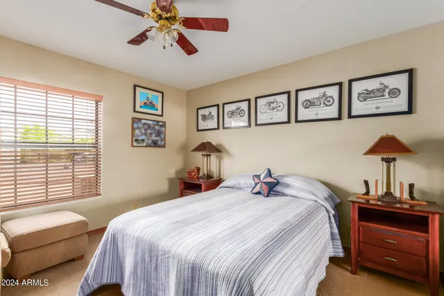 a bedroom with furniture and a window