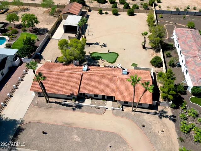 an aerial view of a house with a garden