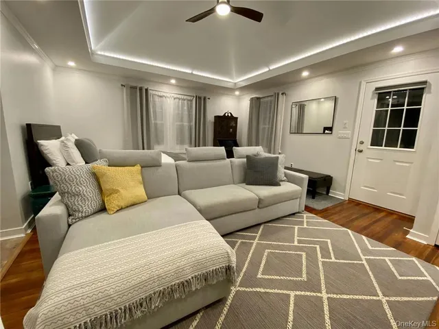a living room with furniture and a rug