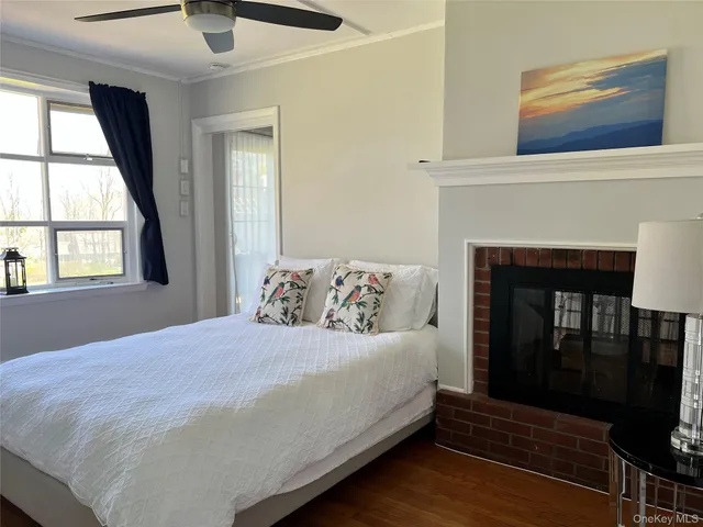 a bedroom with a bed and a fireplace