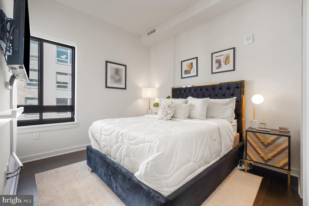 70 N Street Southeast, Unit N1016 Washington, DC 20003 - Photo 11 of 21 a bedroom with a bed and window