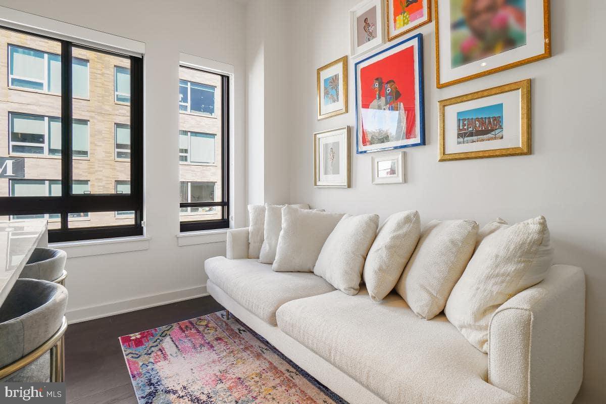 70 N Street Southeast, Unit N1016 Washington, DC 20003 - Photo 13 of 21 a living room with furniture and a large window