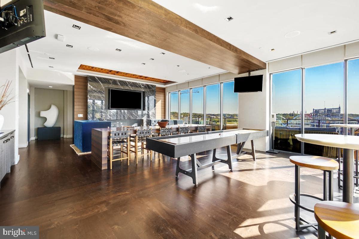 70 N Street Southeast, Unit N1016 Washington, DC 20003 - Photo 20 of 21 a living room with lots of furniture and view of kitchen