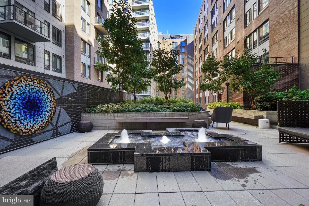 70 N Street Southeast, Unit N1016 Washington, DC 20003 - Photo 21 of 21 a view of a patio with couches table and chairs and potted plants