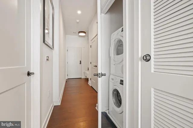 a view of a hallway with washer and dryer