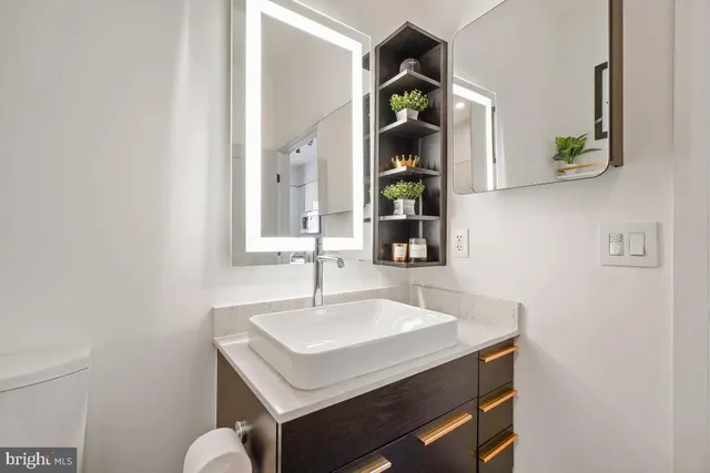 a bathroom with a sink and a mirror