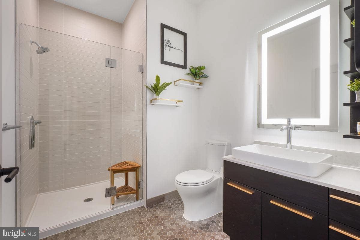 70 N Street Southeast, Unit N1016 Washington, DC 20003 - Photo 10 of 21 a bathroom with a sink toilet and shower