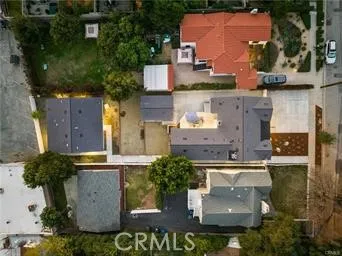 a view of a house with a mountain in the background