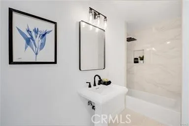 a bedroom with a large bed and a dresser