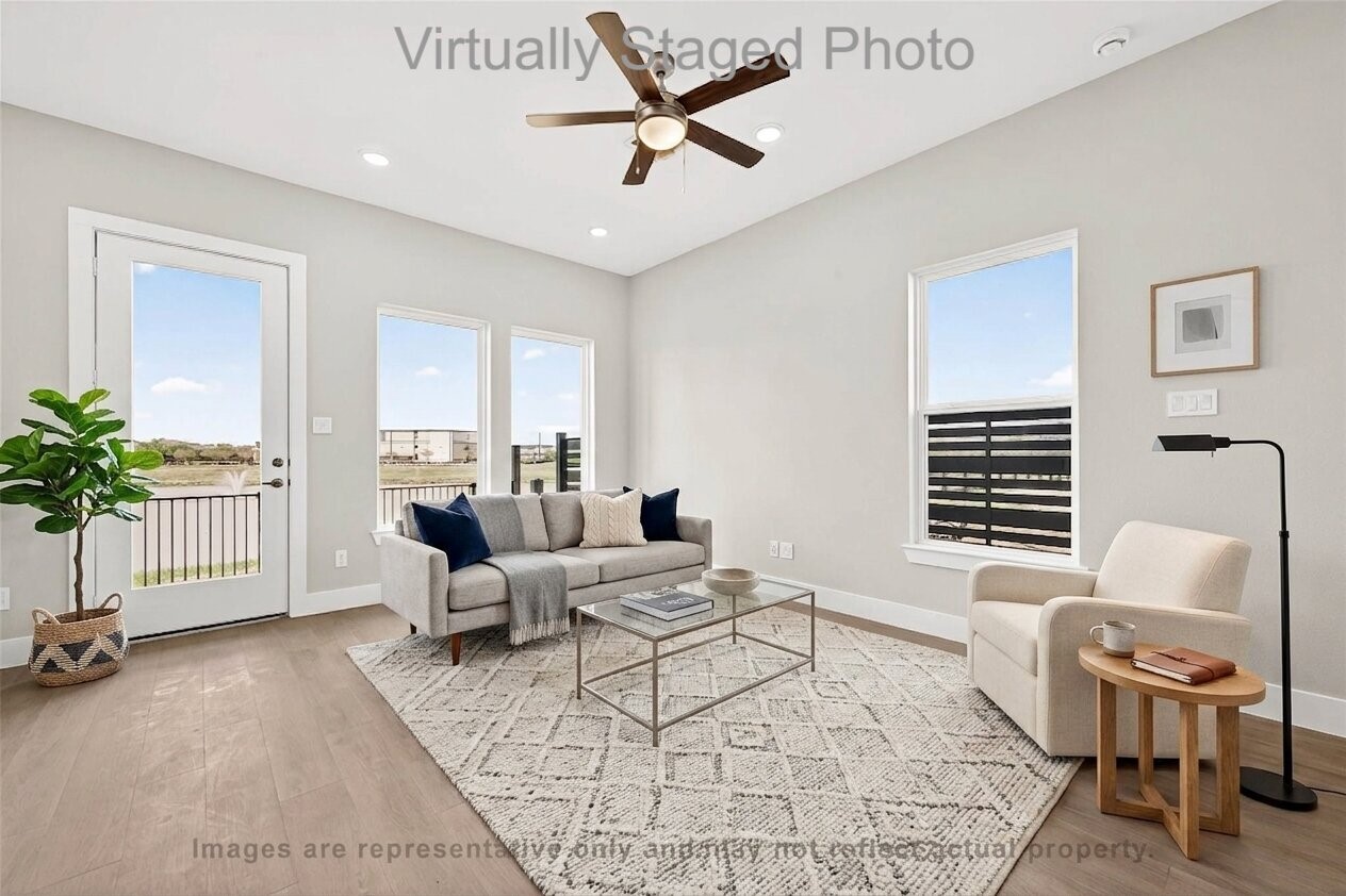 10719 Mason Road, Unit 39 Richmond, TX 77406 - Photo 12 of 50 Virtual Staging - Modern living room featuring neutral-toned furniture, a glass coffee table, and large windows that let in plenty of natural light
