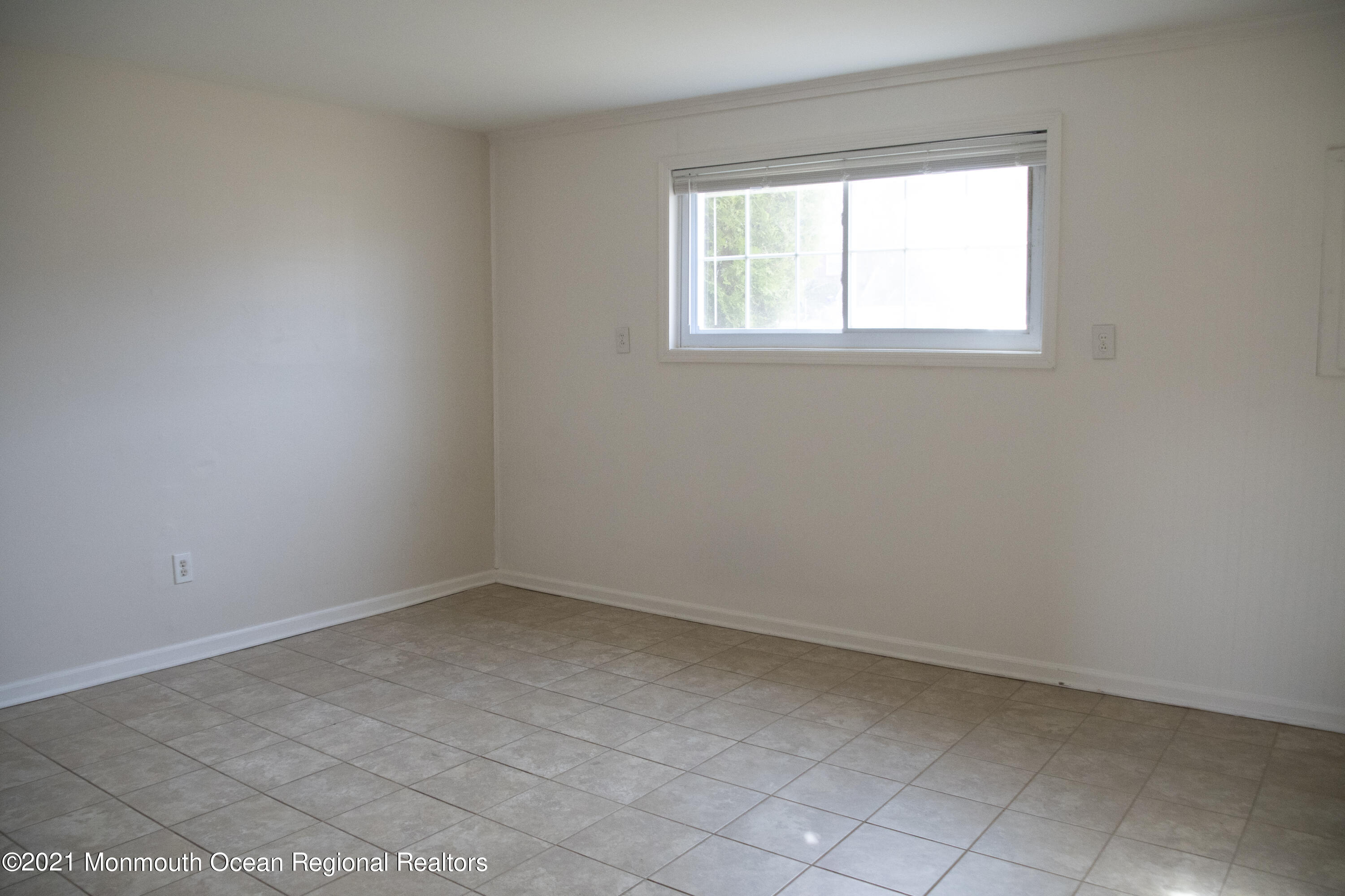 326 Sawmill Road, Unit 132 Brick, NJ 08724 - Photo 14 of 18 an empty room with a window