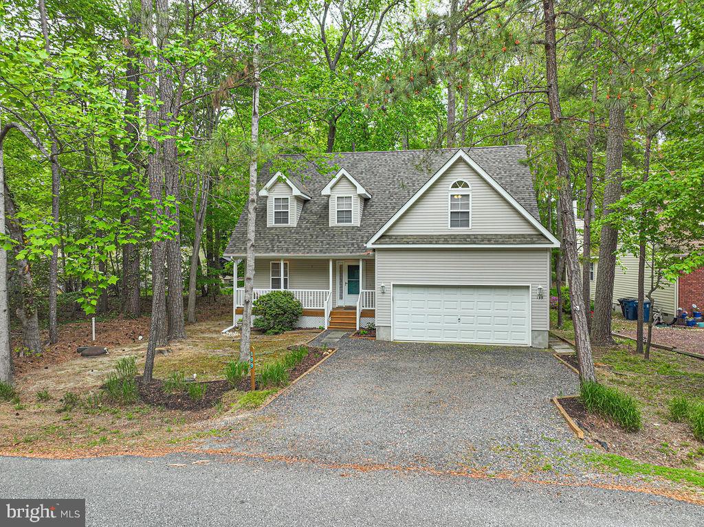 199 Windjammer Road Ocean Pines, MD 21811 - Photo 2 of 62 a front view of a house with a yard and garage