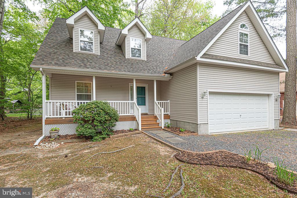 199 Windjammer Road Ocean Pines, MD 21811 - Photo 3 of 62 a view of a house with a yard and potted plants