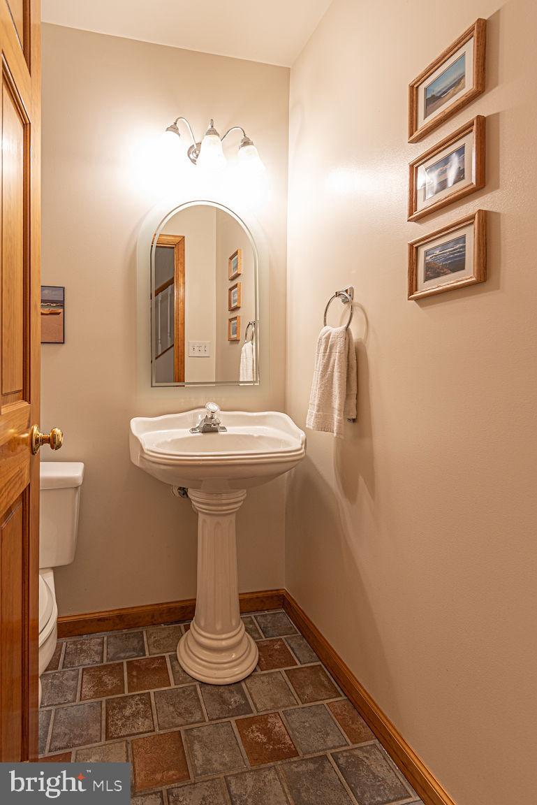 199 Windjammer Road Ocean Pines, MD 21811 - Photo 36 of 62 a bathroom with a sink toilet and a mirror