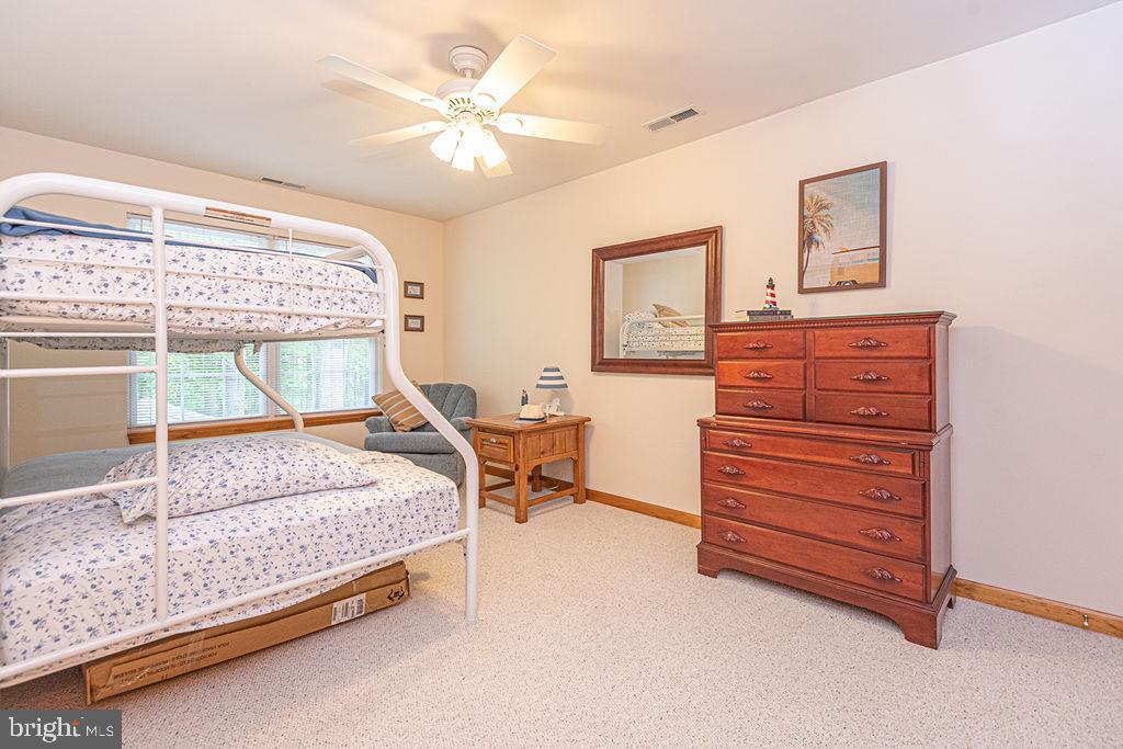 199 Windjammer Road Ocean Pines, MD 21811 - Photo 49 of 62 a bedroom with a bed and a dresser