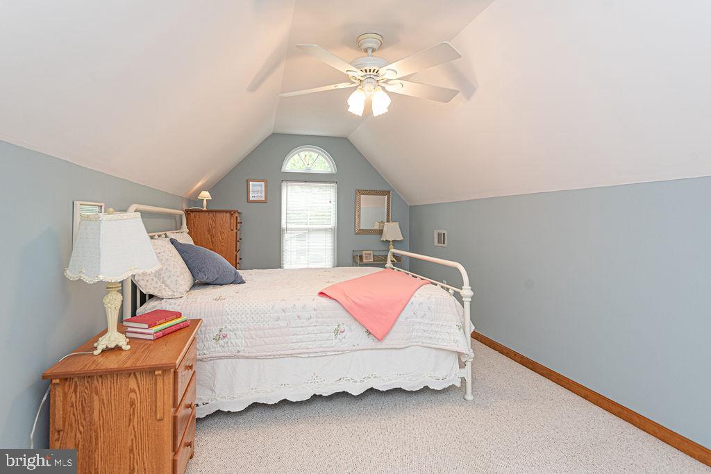 199 Windjammer Road Ocean Pines, MD 21811 - Photo 53 of 62 a bedroom with a bed and a chandelier