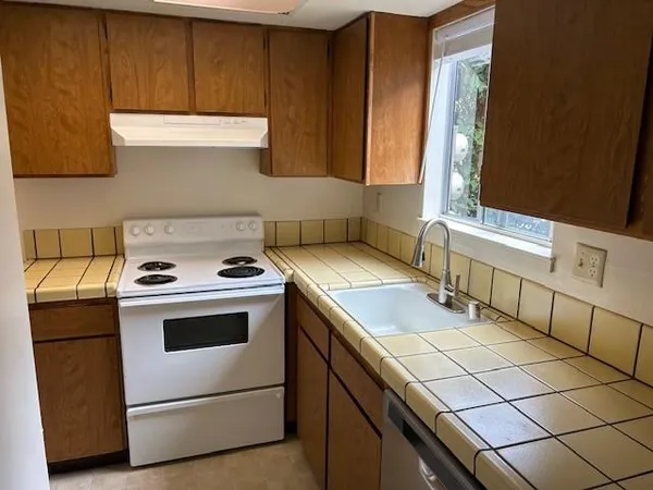 a kitchen with a stove and a microwave