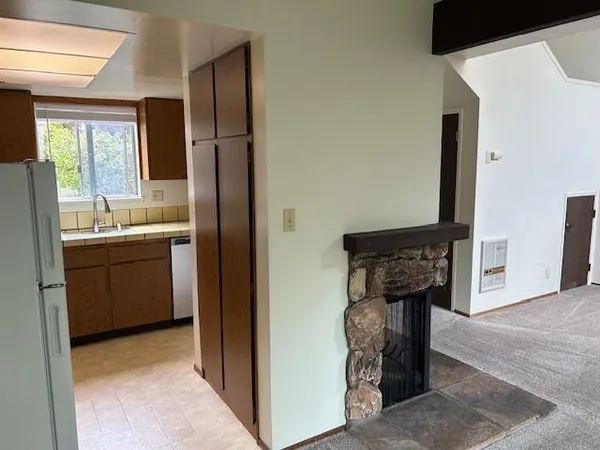 a kitchen with a sink and a refrigerator
