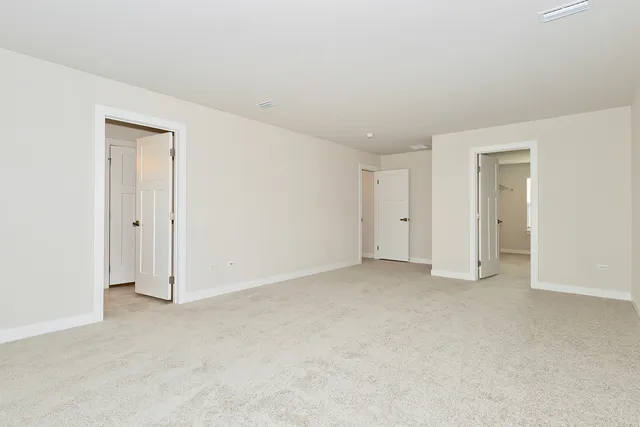 an empty room with closet area